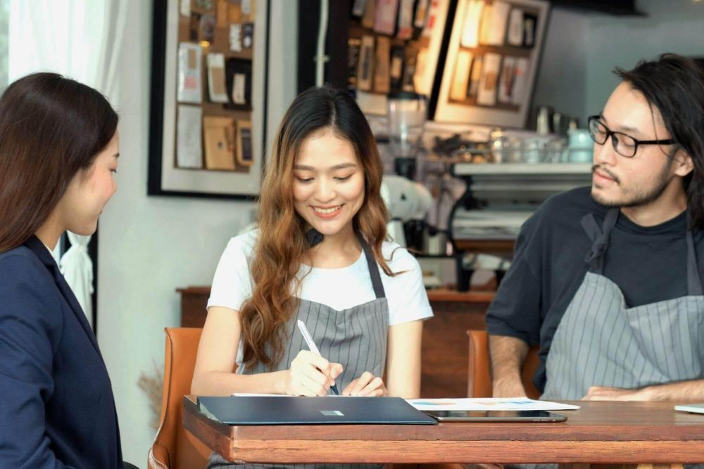 Man and woman reviewing a restaurant franchise