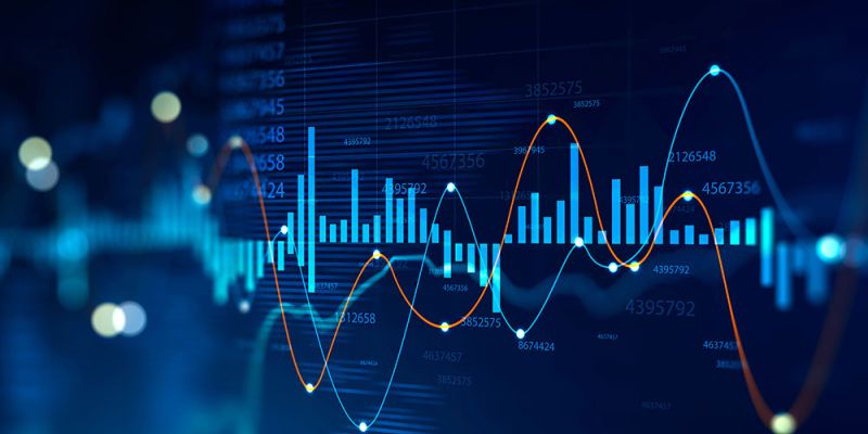 Abstract financial charts with glowing data lines and bar graphs on a blue background, illustrating market trends.