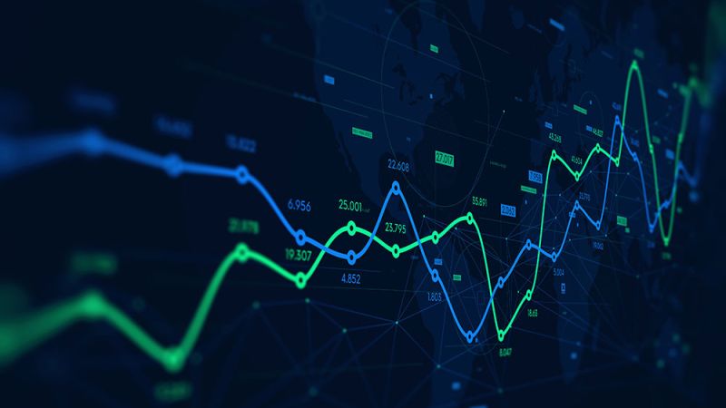 Line graph over a world map representing global financial trends and data analysis.