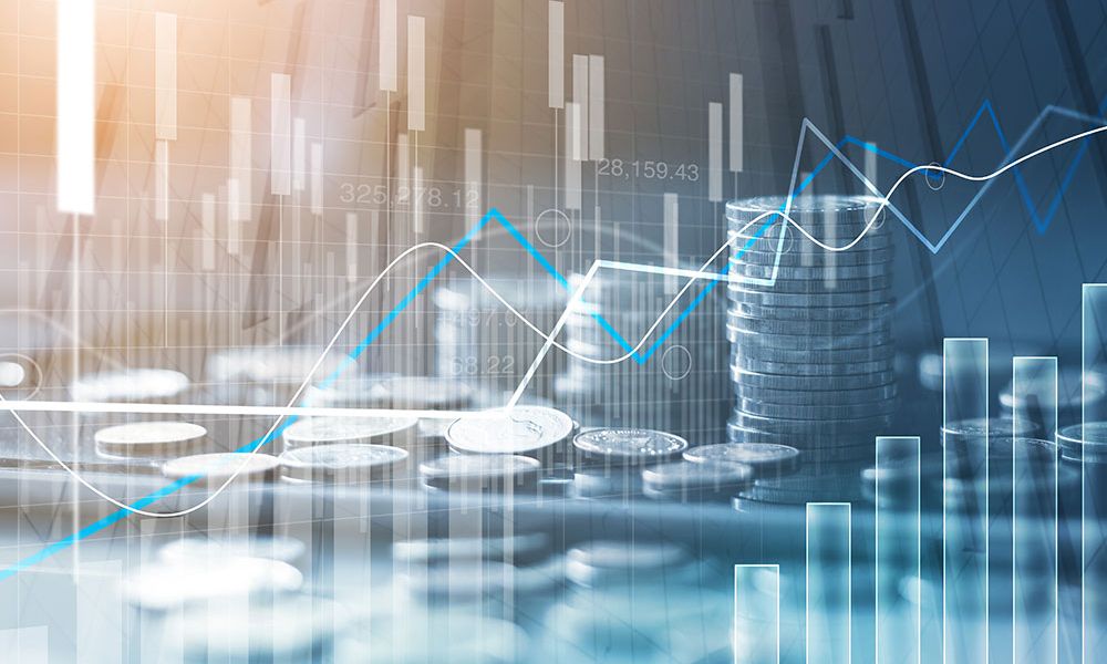 Stacked coins with financial charts, rising graph lines, and bar charts representing market growth and investment trends.