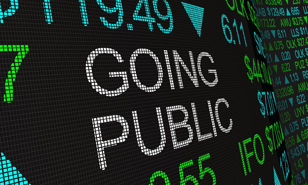 Stock market display showing text 'Going Public' and financial data, indicating a company's IPO process.