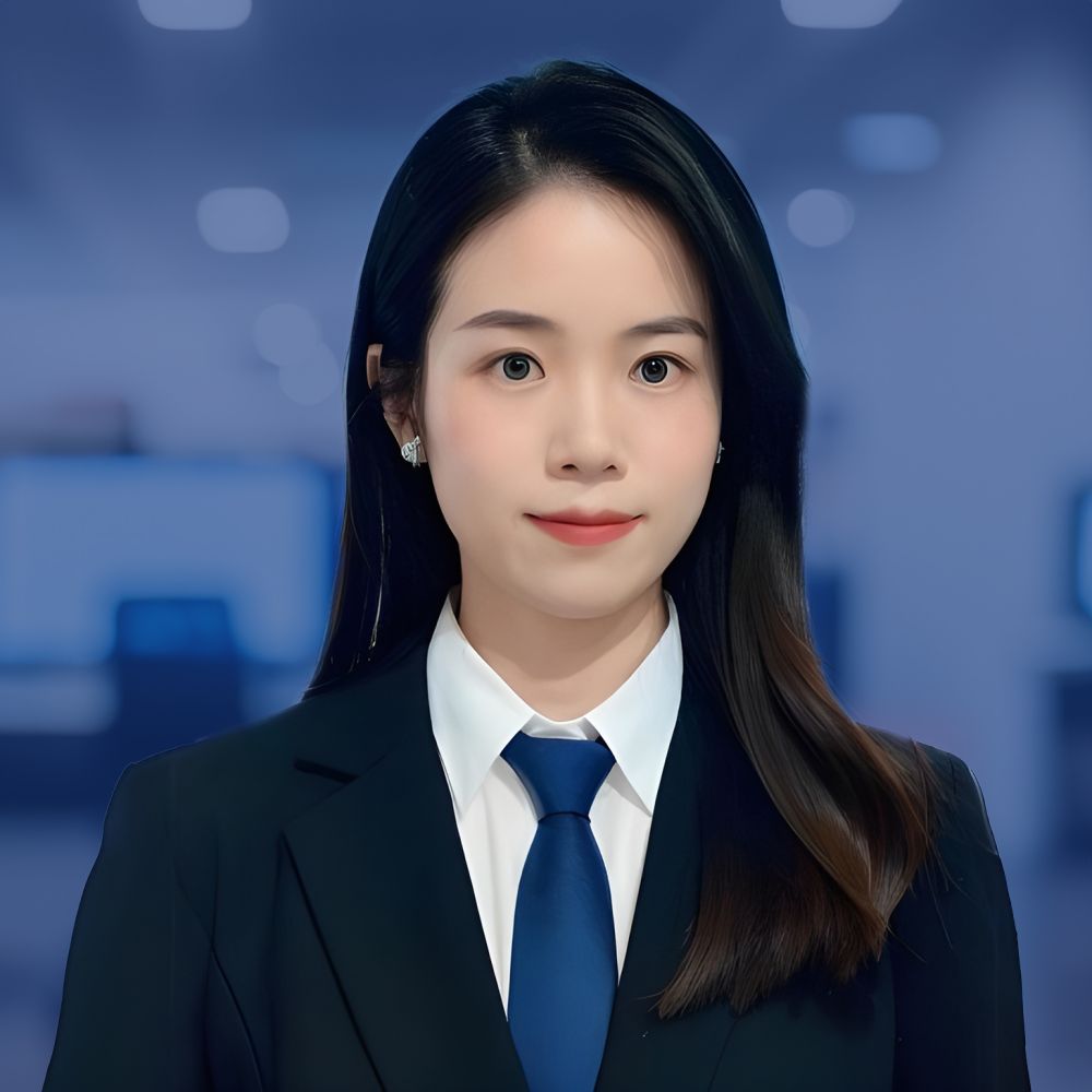 Professional woman in business attire with a blue tie in an office setting.