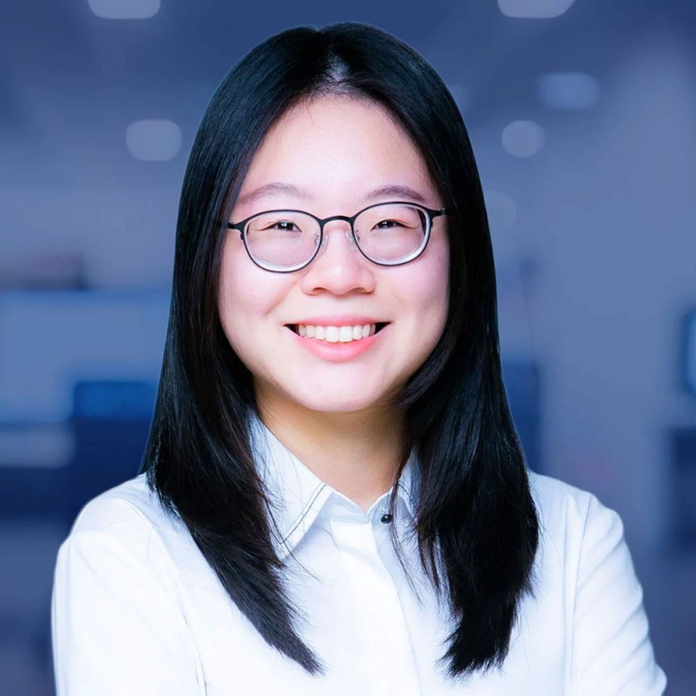 Weiwei Lu with glasses in an office setting.