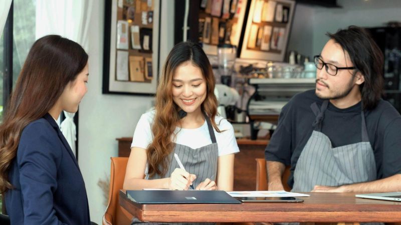 Man and woman reviewing a restaurant franchise