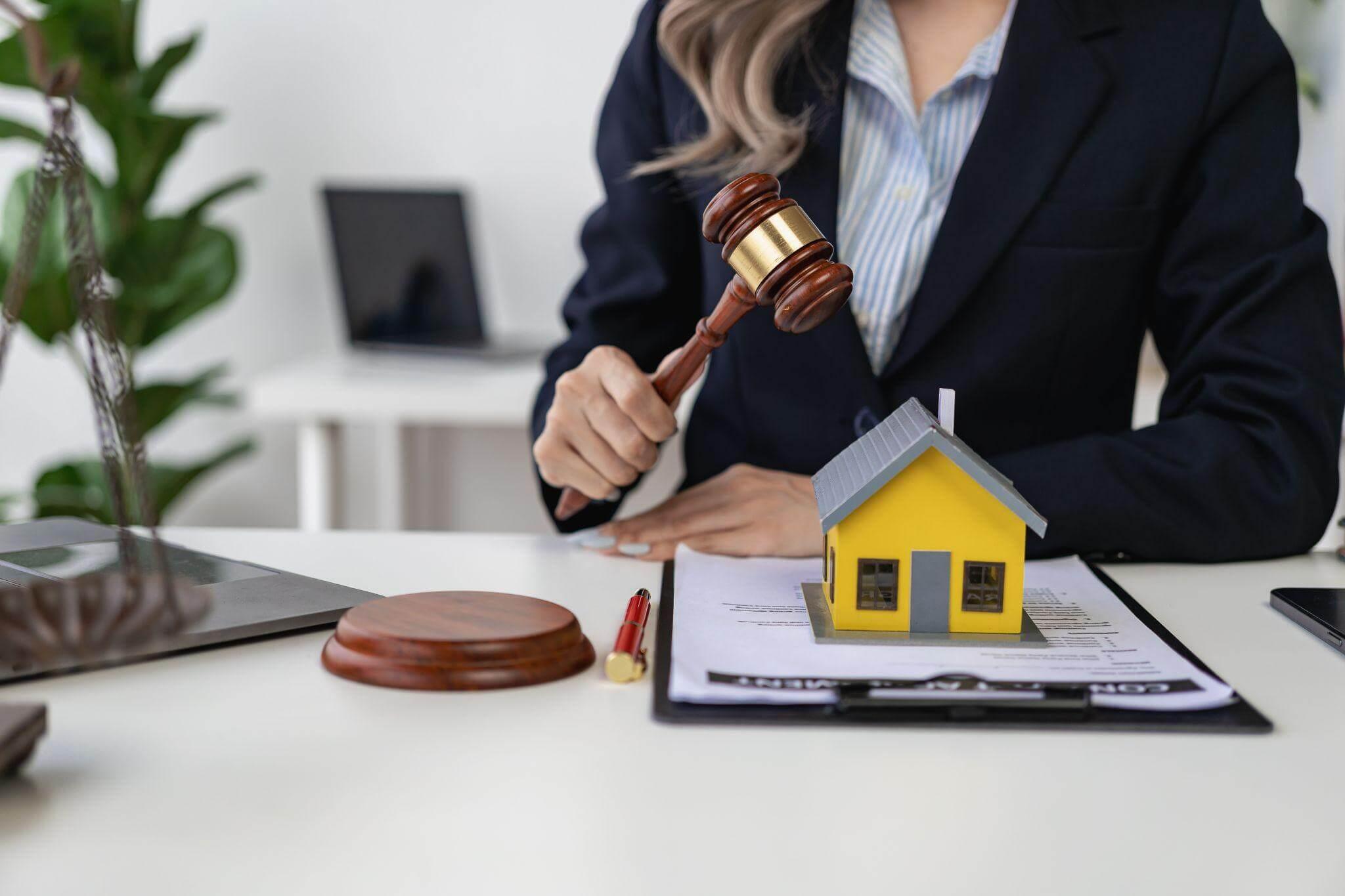 a woman sitting at a desk holding a judge